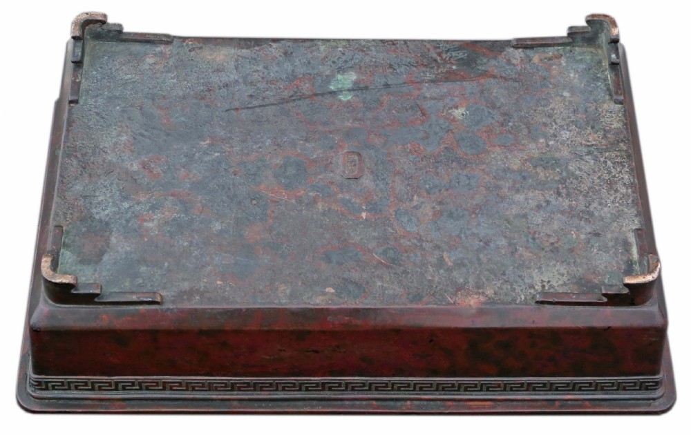 A rectangular dark bronze Japanese suiban planter featuring a key fret relief pattern around the upper border and four corner bracket feet. View VI