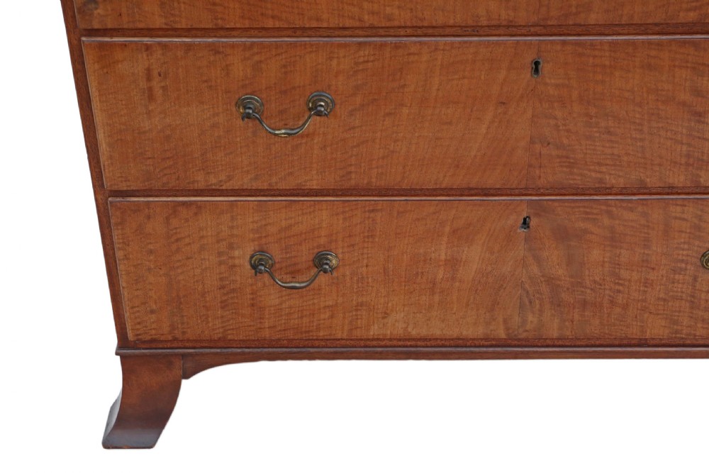 A nineteenth-century mahogany tallboy chest on chest featuring figured wood drawer fronts, brass drop handles, a dentil cornice, and splayed bracket feet. View VI