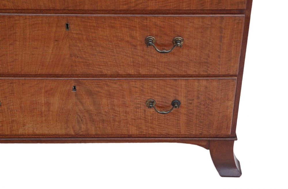 A nineteenth-century mahogany tallboy chest on chest featuring figured wood drawer fronts, brass drop handles, a dentil cornice, and splayed bracket feet. View VII
