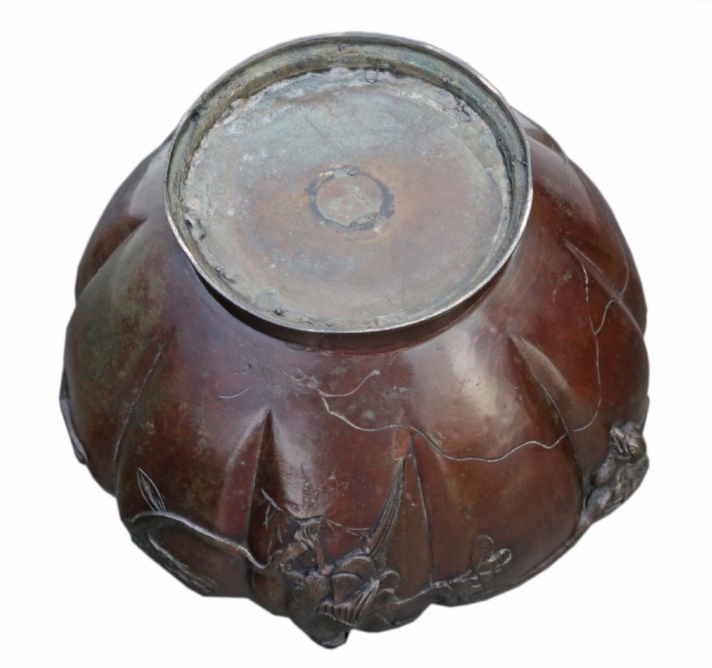 A large lobed dark bronze Japanese Meiji period jardiniere featuring raised high-relief carvings of birds perched on blossoming branches. View VI