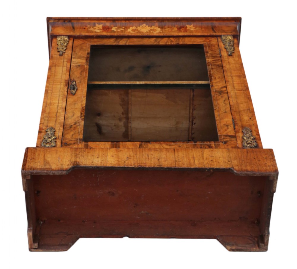 A Victorian burr walnut pier display cabinet featuring a single glazed door, floral marquetry inlay at the upper frieze, and brass mounts on the sides. View X