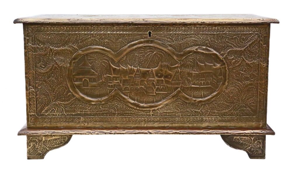 A rectangular wooden storage chest fully encased in hand-embossed brass sheeting featuring Chinoiserie landscape scenes and foliate borders. View II