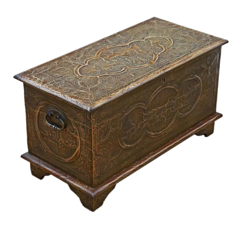 A rectangular wooden storage chest fully encased in hand-embossed brass sheeting featuring Chinoiserie landscape scenes and foliate borders. View VI