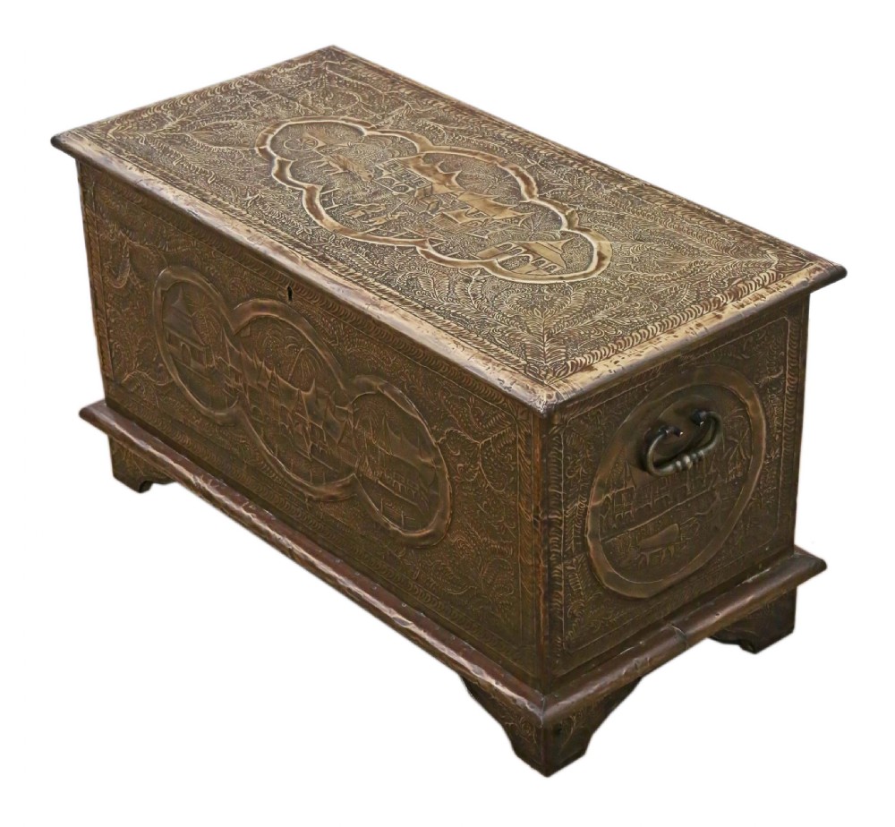 A rectangular wooden storage chest fully encased in hand-embossed brass sheeting featuring Chinoiserie landscape scenes and foliate borders. View VII