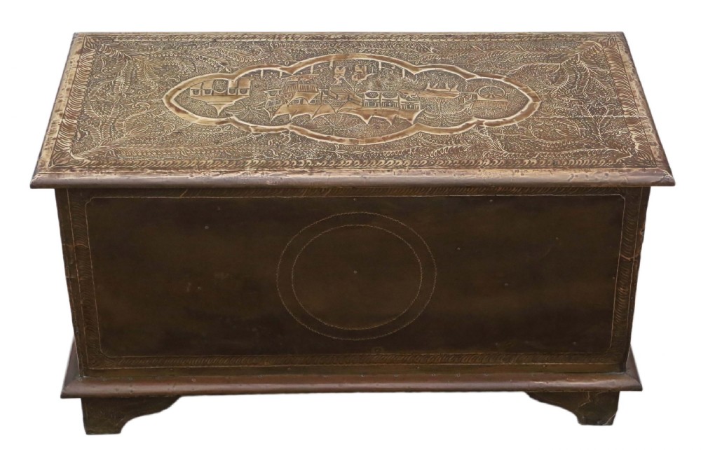A rectangular wooden storage chest fully encased in hand-embossed brass sheeting featuring Chinoiserie landscape scenes and foliate borders. View VIII