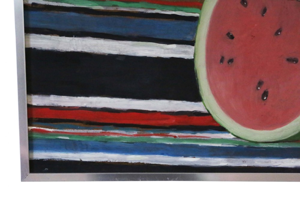 A mid-century style oil on board still life painting depicting a cut watermelon set against a boldly striped background, presented in a white mount and slim metal frame. View IV