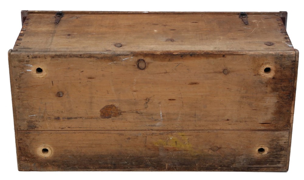 An antique rectangular wooden coffer with a natural pine lid and a red and dark green painted front featuring three arched panels with floral motifs. View VIII
