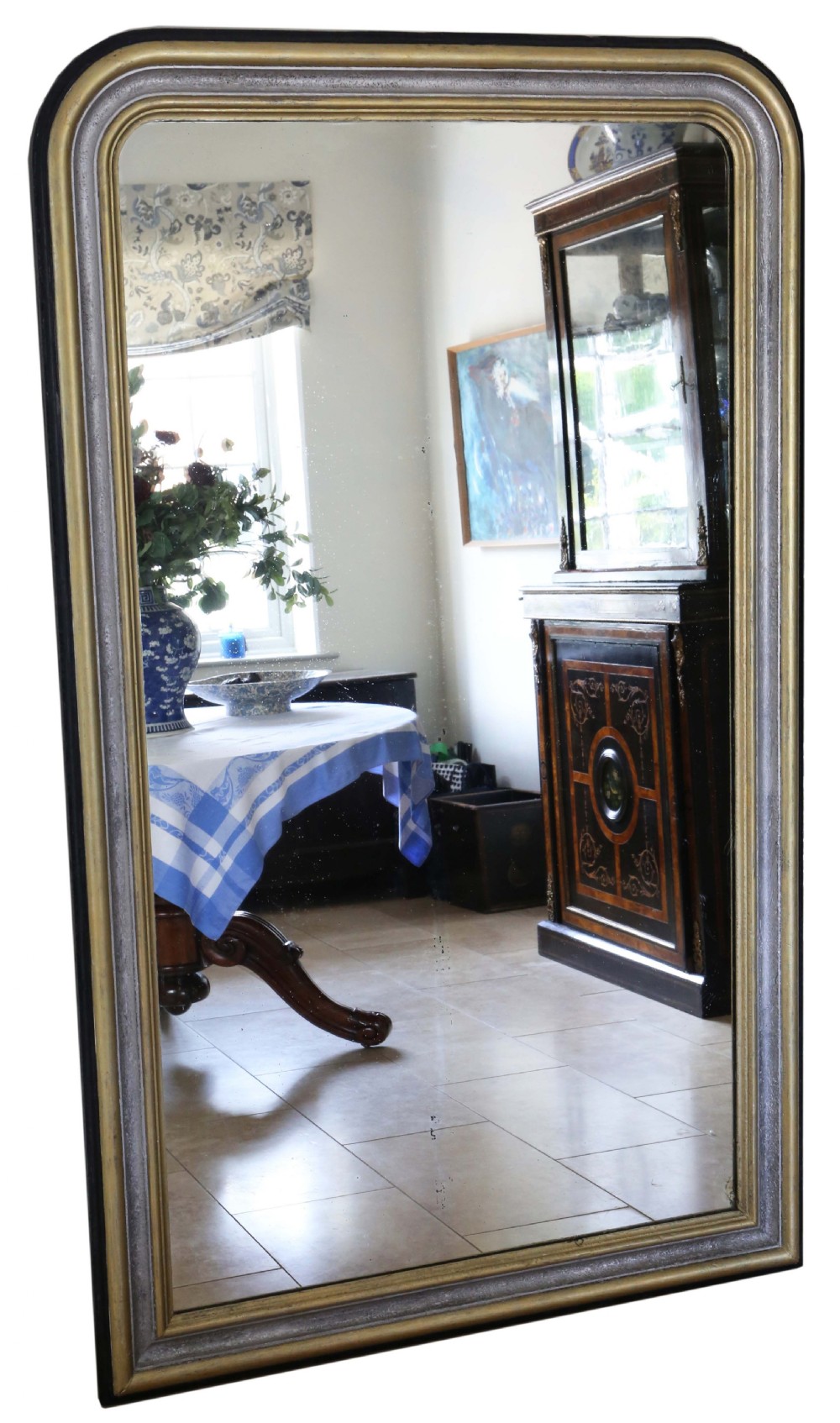 A large 19th-century overmantel mirror with a dark ebonised frame featuring inner silvered and gilt mouldings and rounded upper corners.