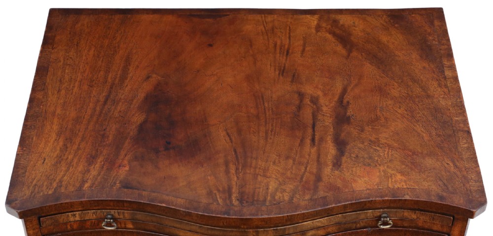 Antique quality small Georgian revival flame mahogany serpentine front chest of drawers C1900 View IV