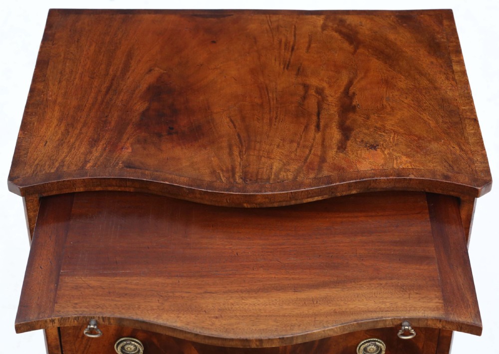 Antique quality small Georgian revival flame mahogany serpentine front chest of drawers C1900 View V