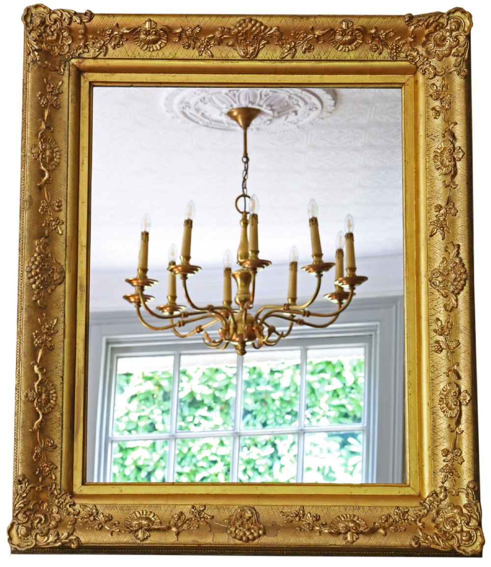 A large 19th-century rectangular wall mirror with a thick gold leaf frame decorated in detailed gesso floral moulding. View III