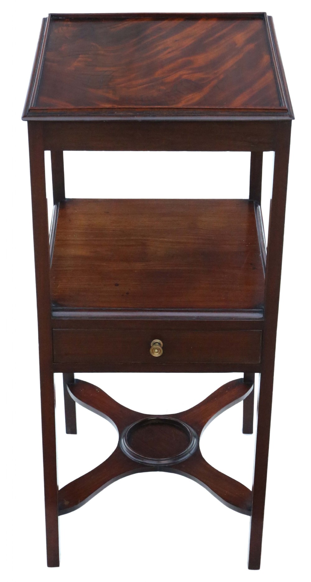An antique Georgian mahogany bedside table featuring a flame mahogany tray top, an open shelf, a single drawer with a brass knob, and an X-shaped lower stretcher.
