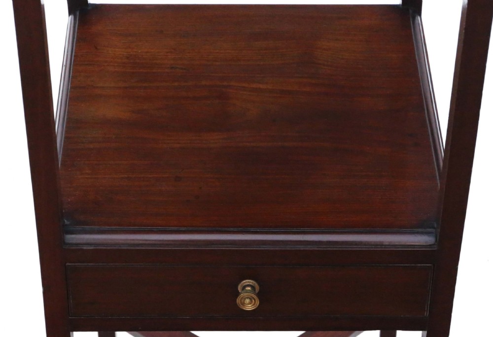 An antique Georgian mahogany bedside table featuring a flame mahogany tray top, an open shelf, a single drawer with a brass knob, and an X-shaped lower stretcher. View III