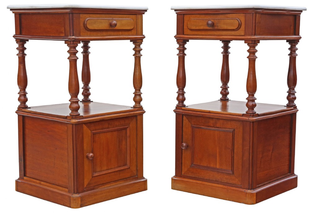 A pair of French walnut bedside tables featuring white marble tops, single upper drawers, open central shelves supported by turned columns, and lower single-door cupboards. View III