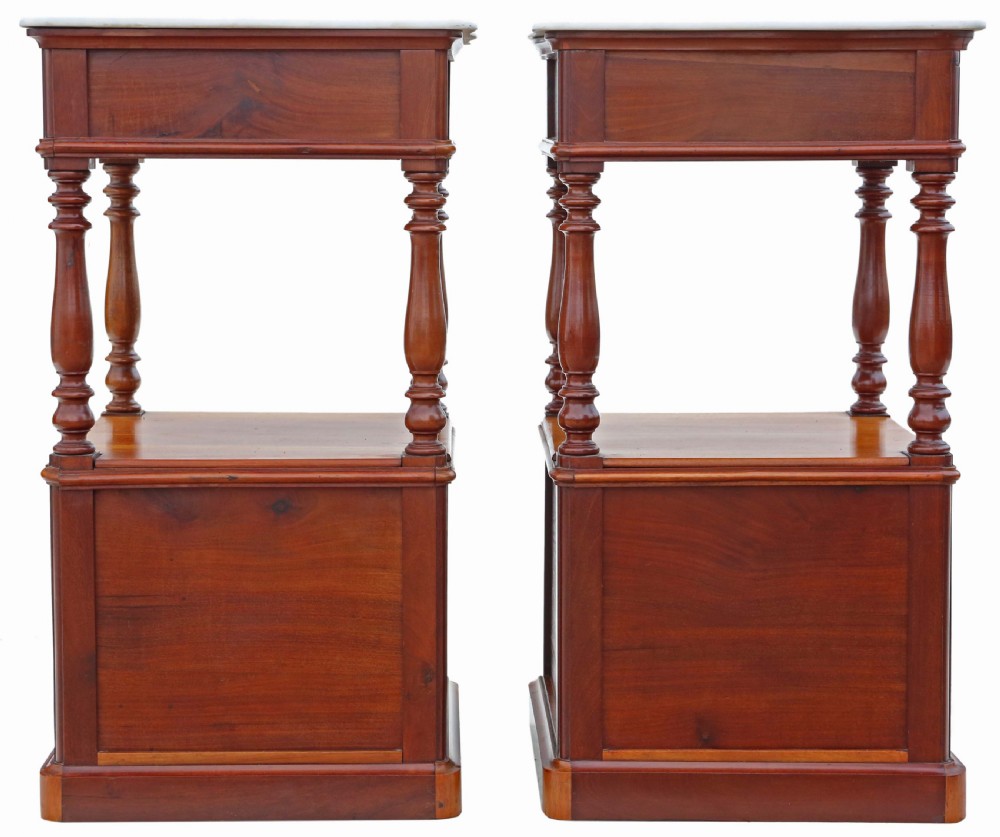 A pair of French walnut bedside tables featuring white marble tops, single upper drawers, open central shelves supported by turned columns, and lower single-door cupboards. View IV