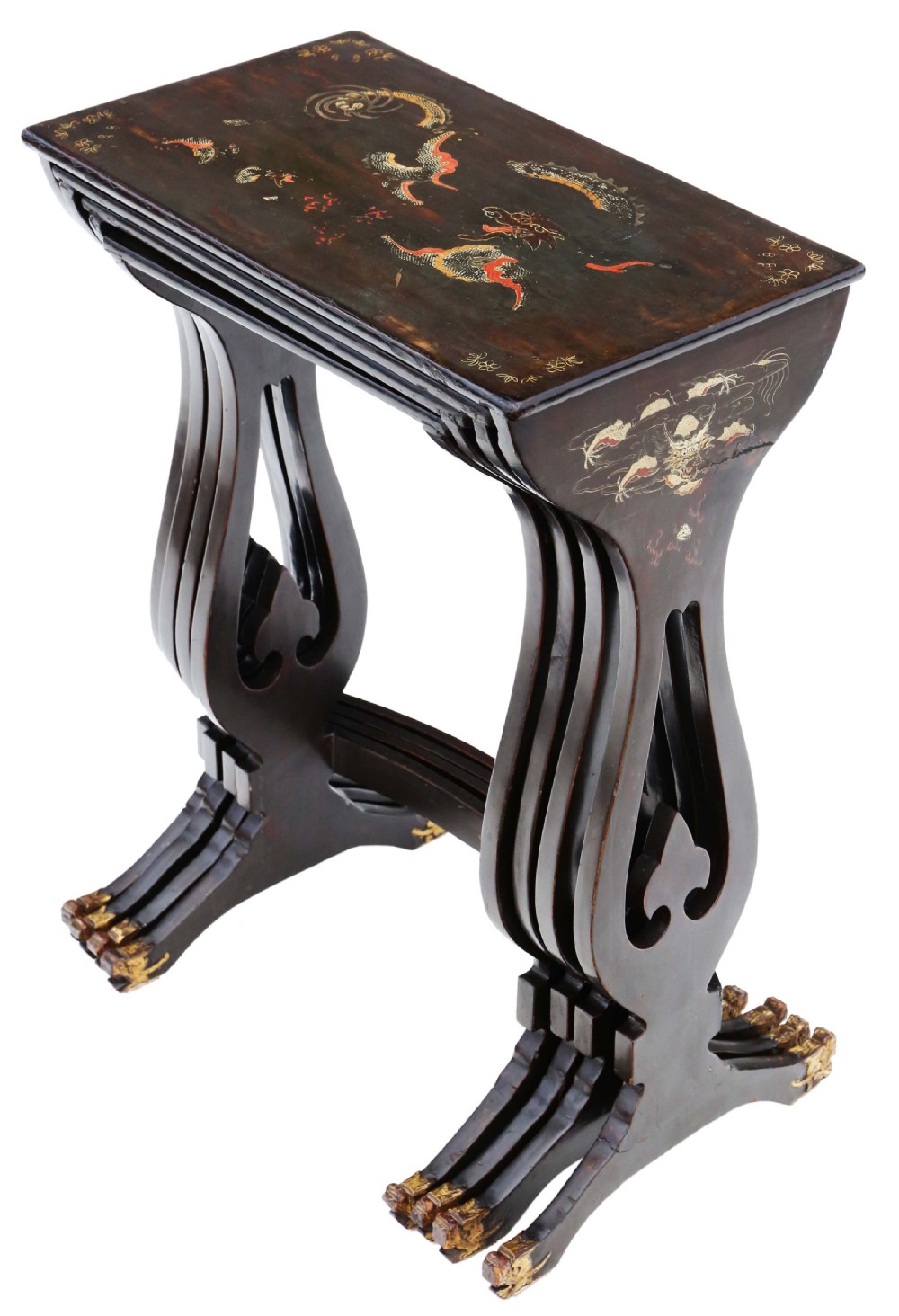A nineteenth-century nest of four black lacquer tables featuring hand-painted Chinese dragon motifs in gold and red with shaped lyre legs.