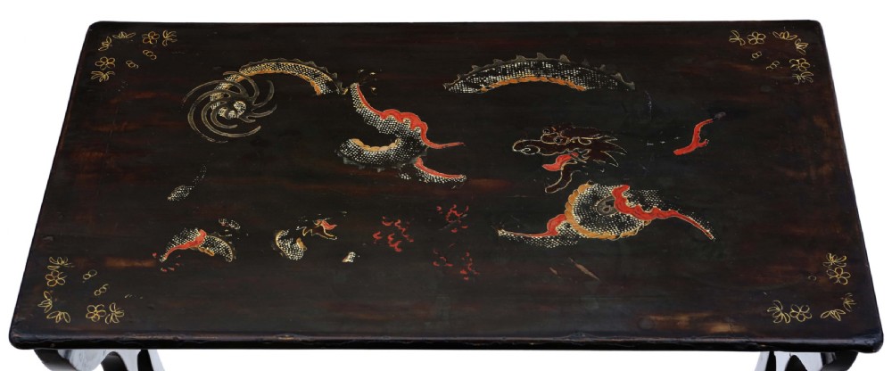 A nineteenth-century nest of four black lacquer tables featuring hand-painted Chinese dragon motifs in gold and red with shaped lyre legs. View III