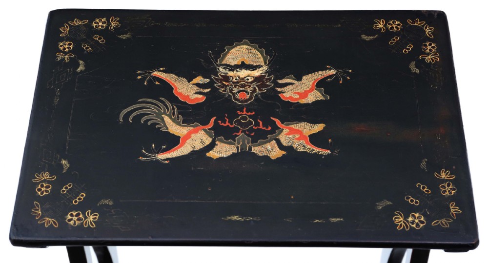 A nineteenth-century nest of four black lacquer tables featuring hand-painted Chinese dragon motifs in gold and red with shaped lyre legs. View VII