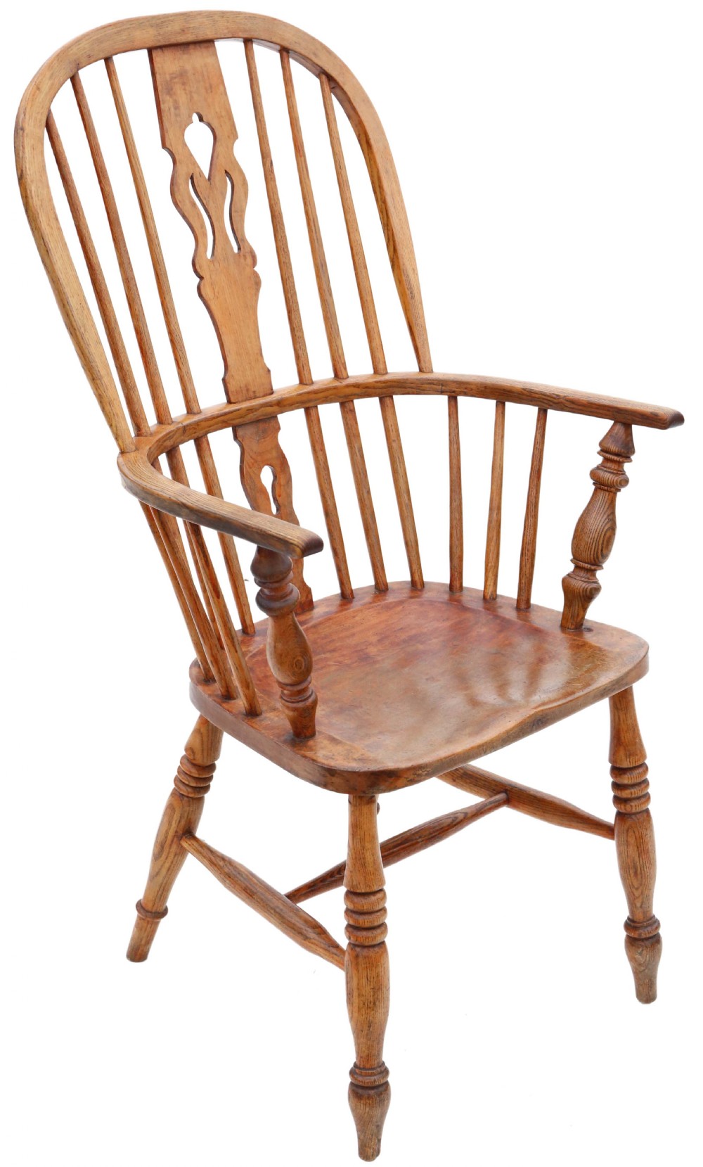 A nineteenth-century English Windsor armchair made from ash and elm wood, featuring a hoop back, pierced central splat, turned legs, and a saddle seat.