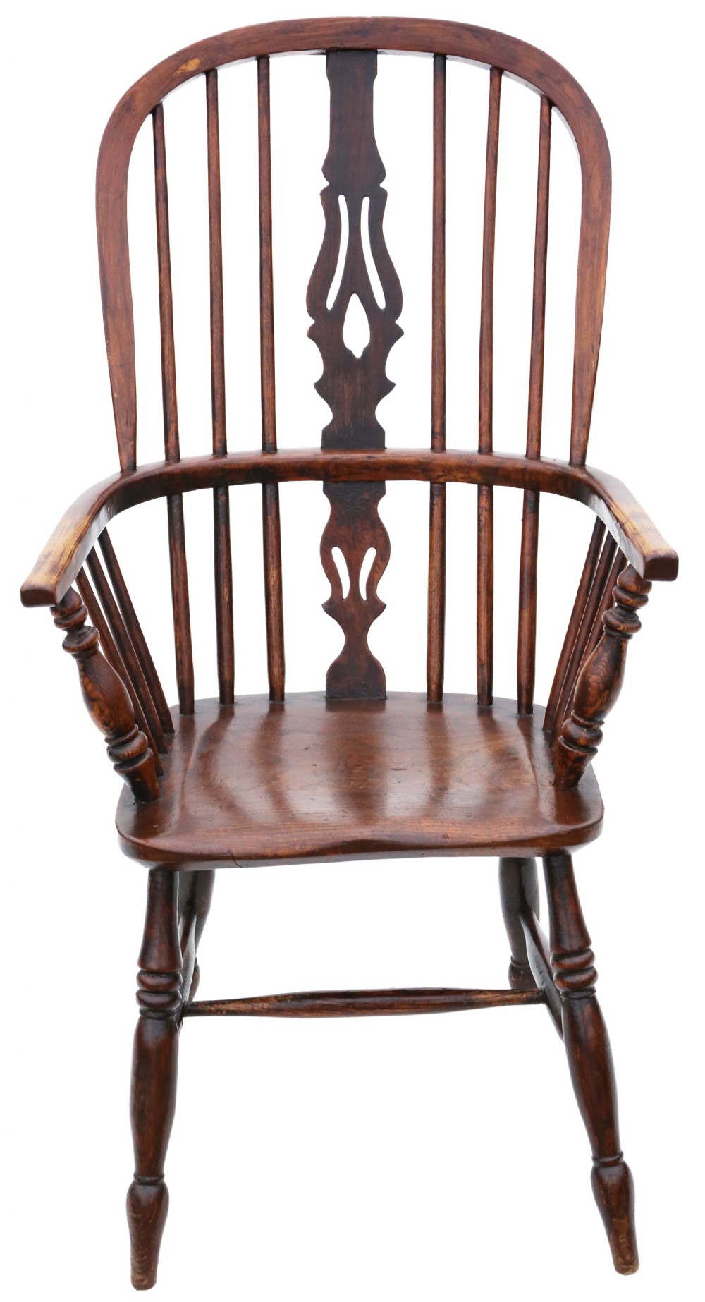 A 19th-century wooden Windsor armchair featuring a hoop back, central pierced splat, spindled backrest, shaped saddle seat, and turned legs.