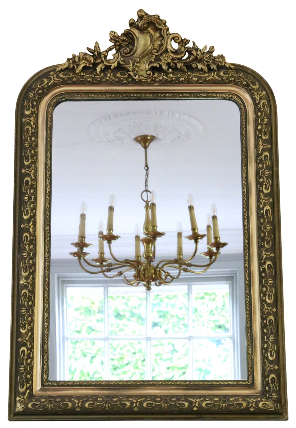 A 19th-century gilt overmantel wall mirror featuring an ornate shell cresting, floral mouldings, and an arched rectangular frame.