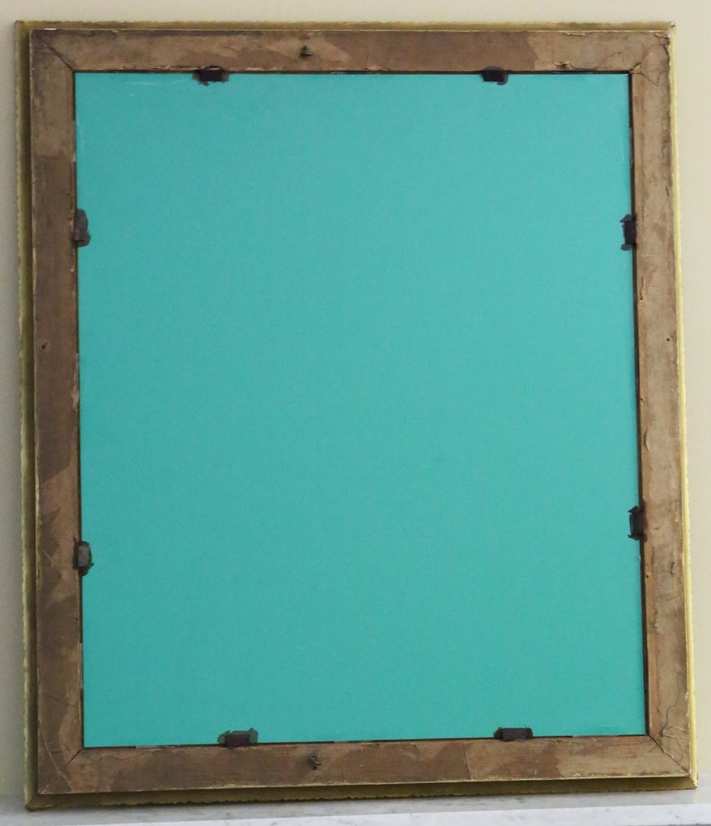 A large rectangular antique gilt overmantel mirror featuring detailed moulded borders and a gold finish. View VI