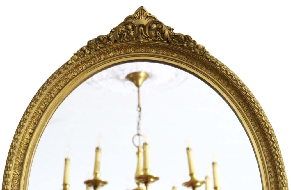 Antique quality 19th Century oval gilt overmantle wall mirror View II