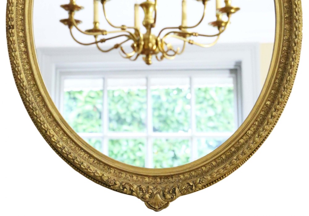 Antique quality 19th Century oval gilt overmantle wall mirror View III