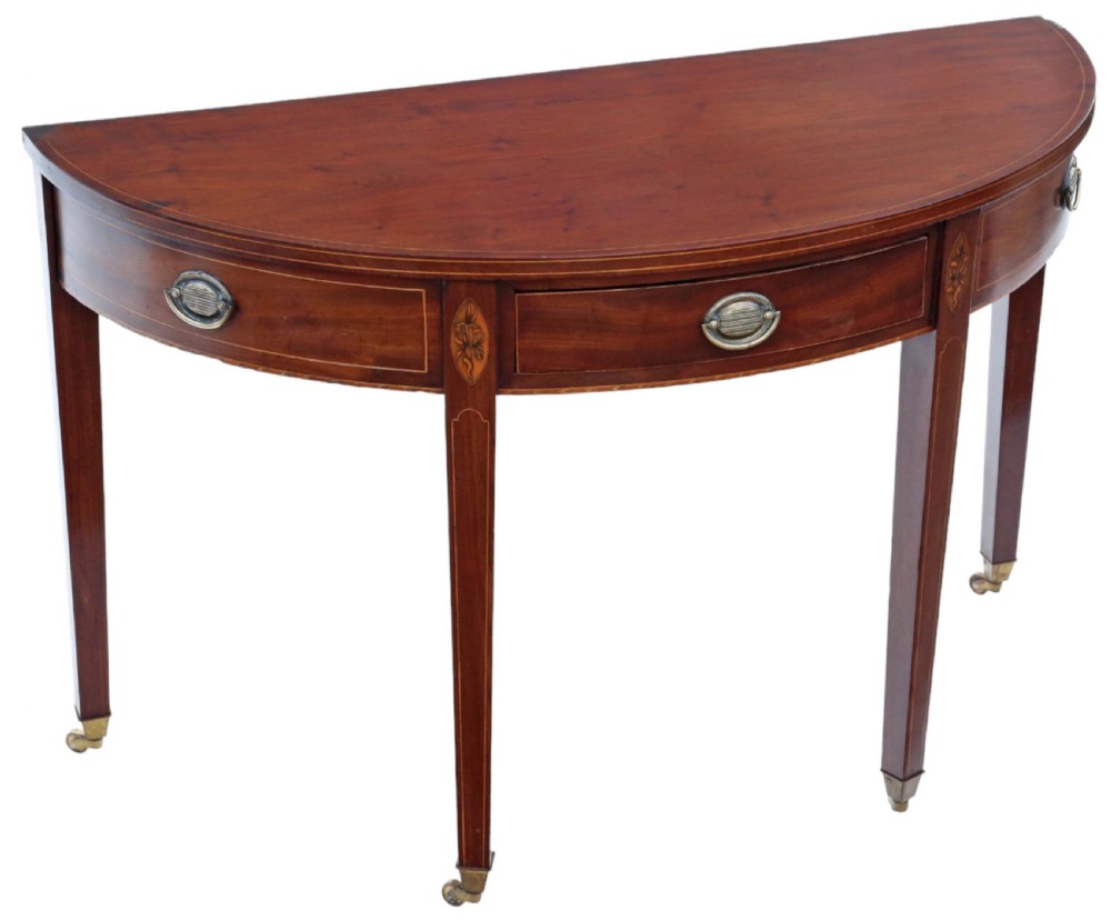 An early nineteenth-century semi-circular mahogany console table featuring line inlay, central drawers with brass ring handles, floral urn marquetry, and square tapered legs on brass castors. View III