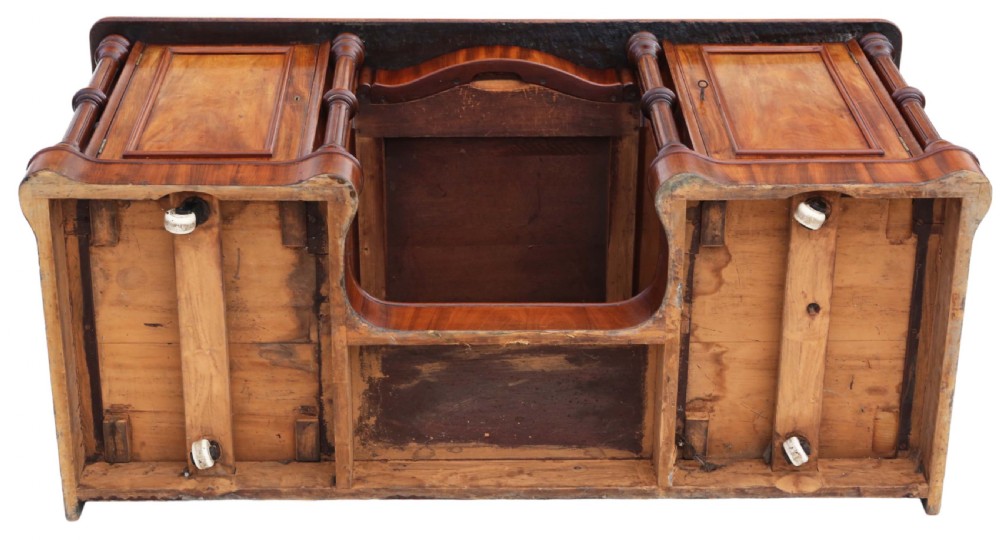 A 19th-century mahogany twin pedestal writing desk featuring a gold-tooled leather inset top, twin cupboard doors flanked by turned columns, and a central kneehole. View IX