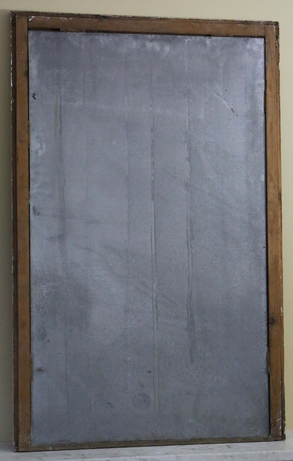 A large 19th-century rectangular wall mirror featuring a distressed pale grey painted wooden frame with moulding and aged glass plate. View VII