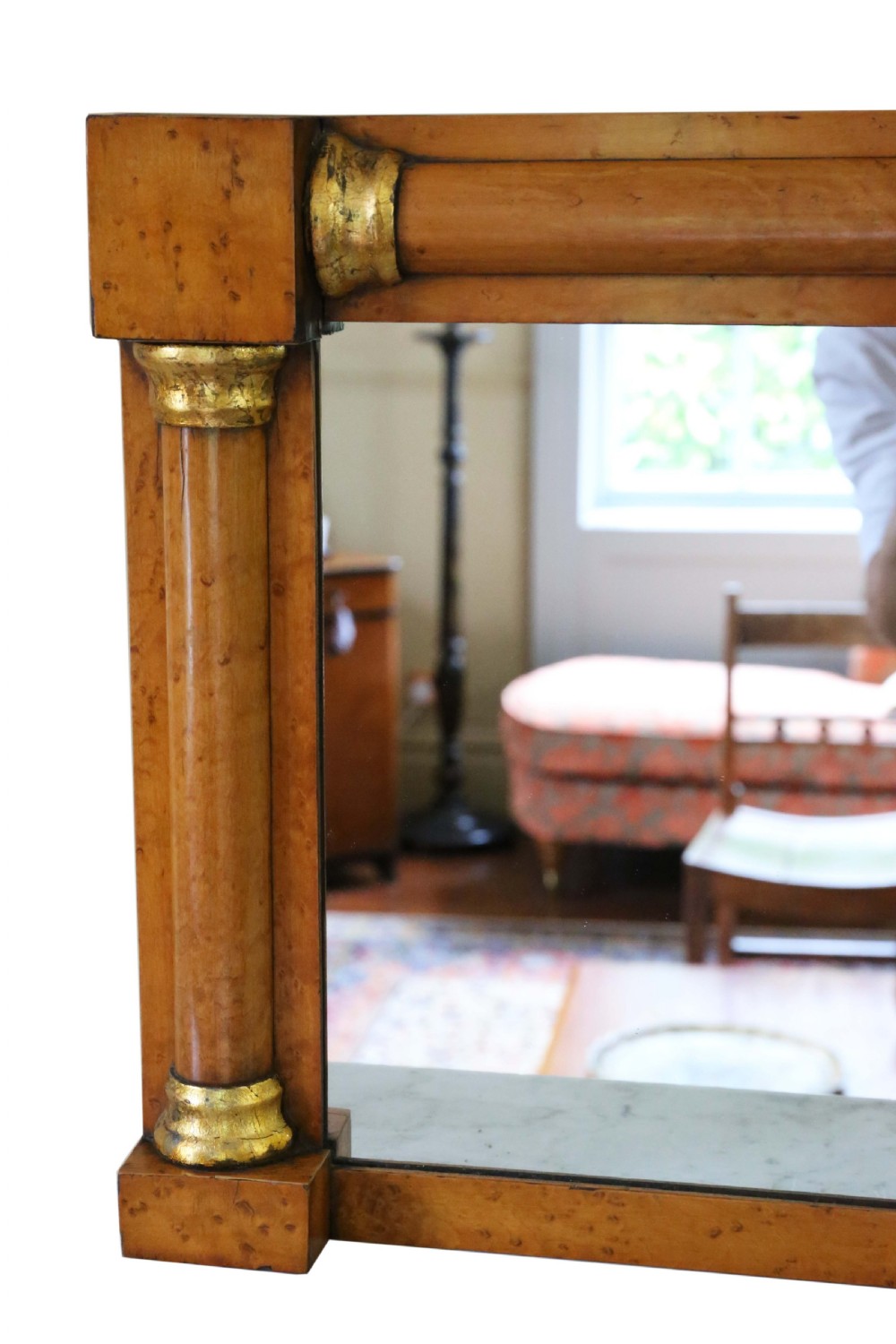 A 19th-century rectangular overmantel wall mirror featuring a birds eye maple veneer frame flanked by half-columns with giltwood capitals. View III