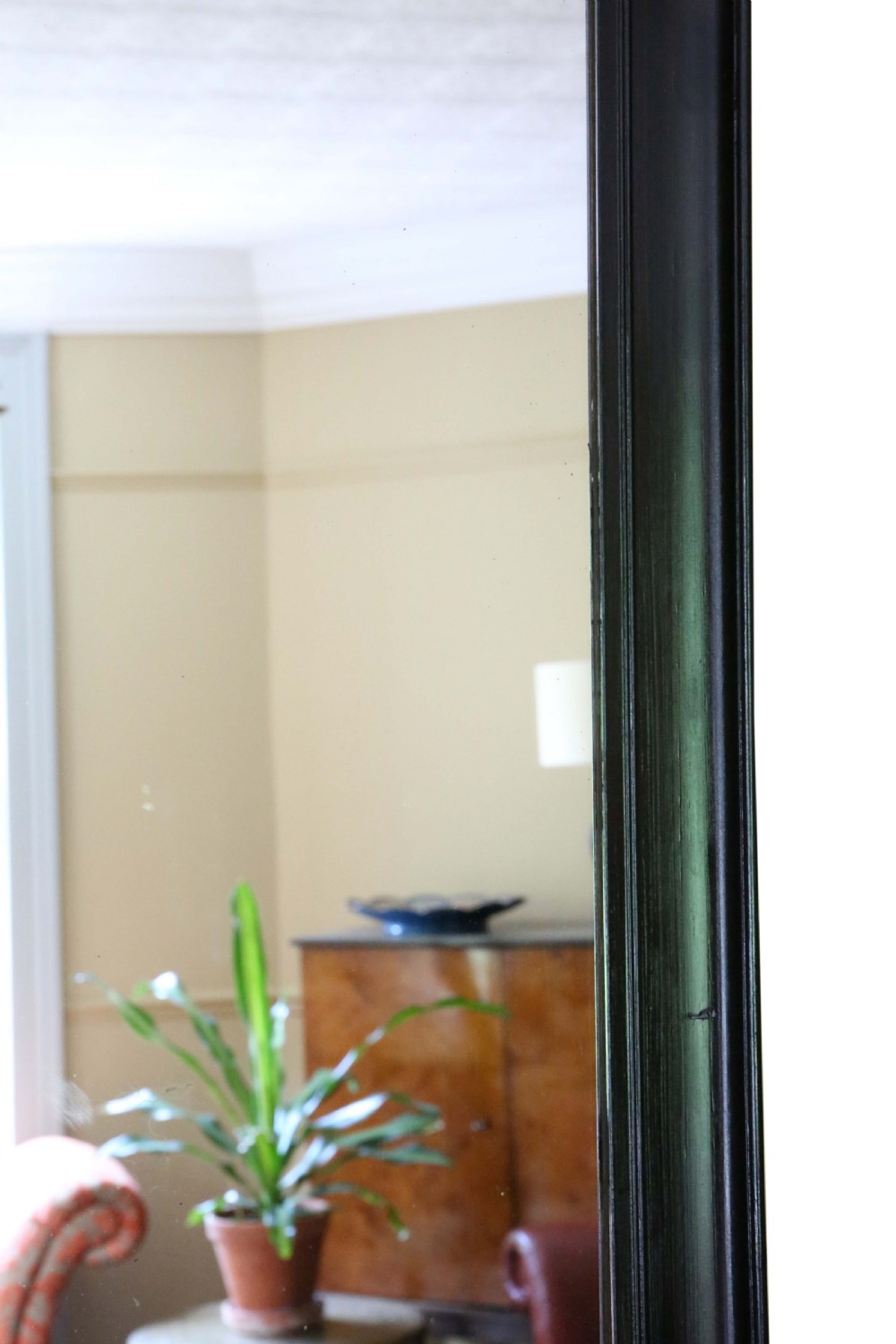 A large rectangular antique wall mirror featuring a simple moulded ebonised black wooden frame. View V