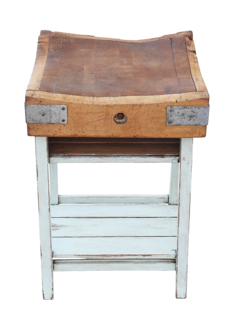 A mid-twentieth-century wooden butchers block with a dished end-grain top, metal corner brackets, and a pale blue painted wooden stand with a lower shelf.