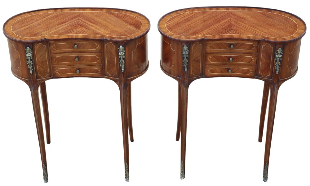 A pair of matching 1920s kidney-shaped timber bedside tables featuring inlaid veneering, central drawers, cabriole legs, and metal knee mounts. View II