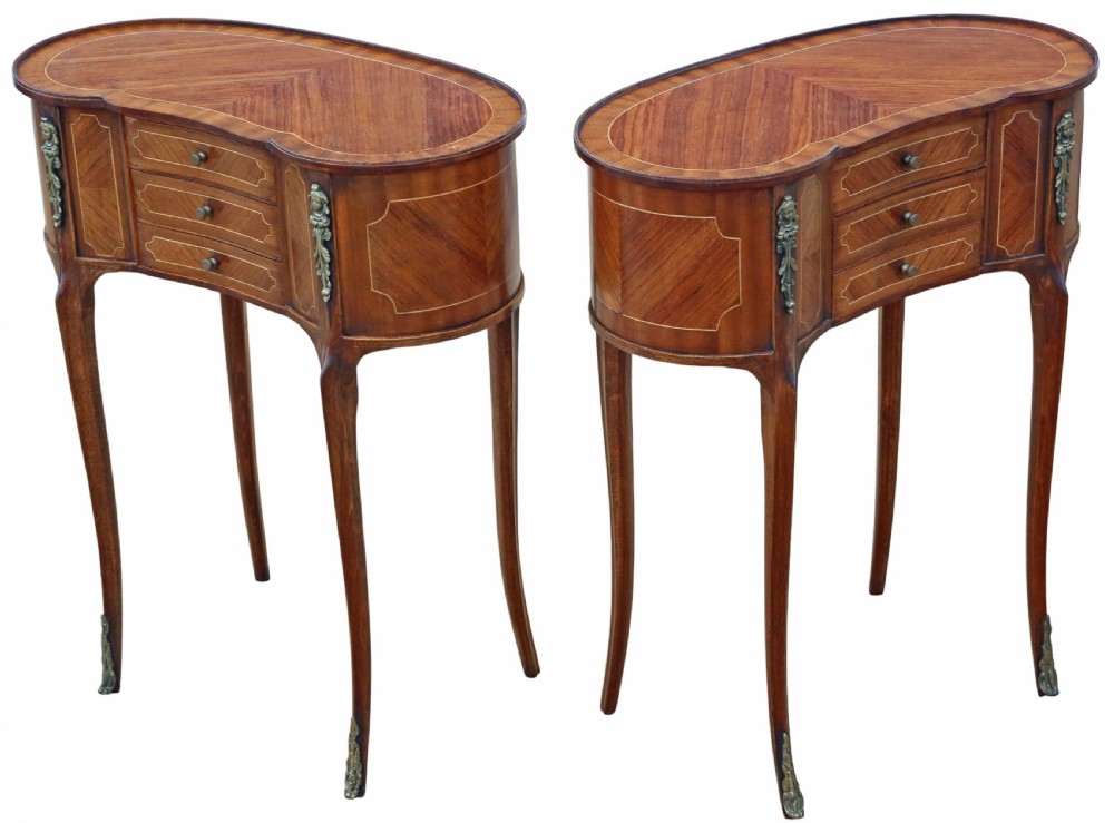 A pair of matching 1920s kidney-shaped timber bedside tables featuring inlaid veneering, central drawers, cabriole legs, and metal knee mounts. View III