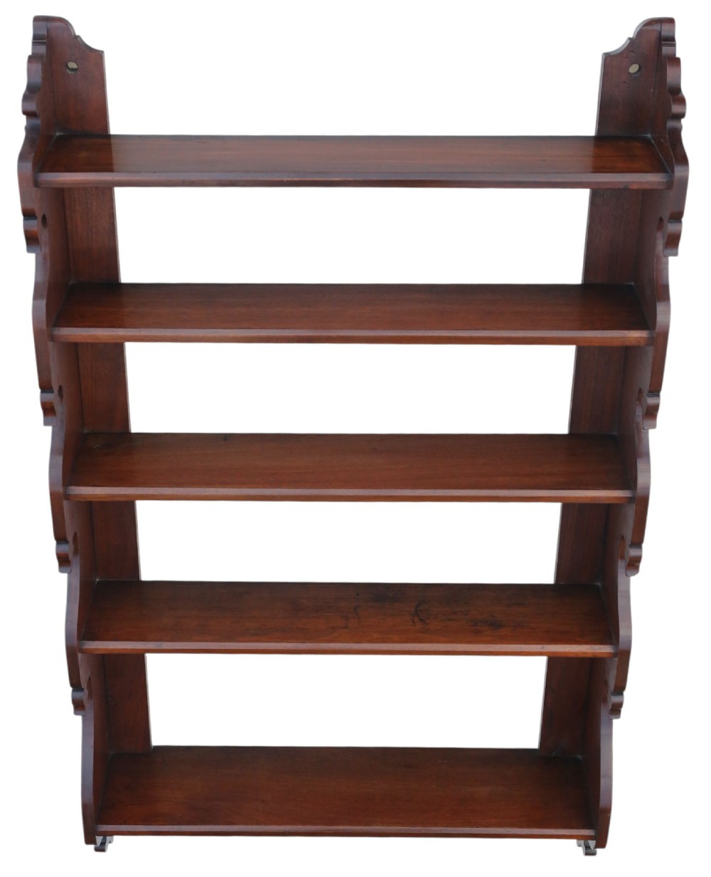 A nineteenth-century mahogany hanging wall shelf unit featuring five tiers and decorative carved scroll sides. View II