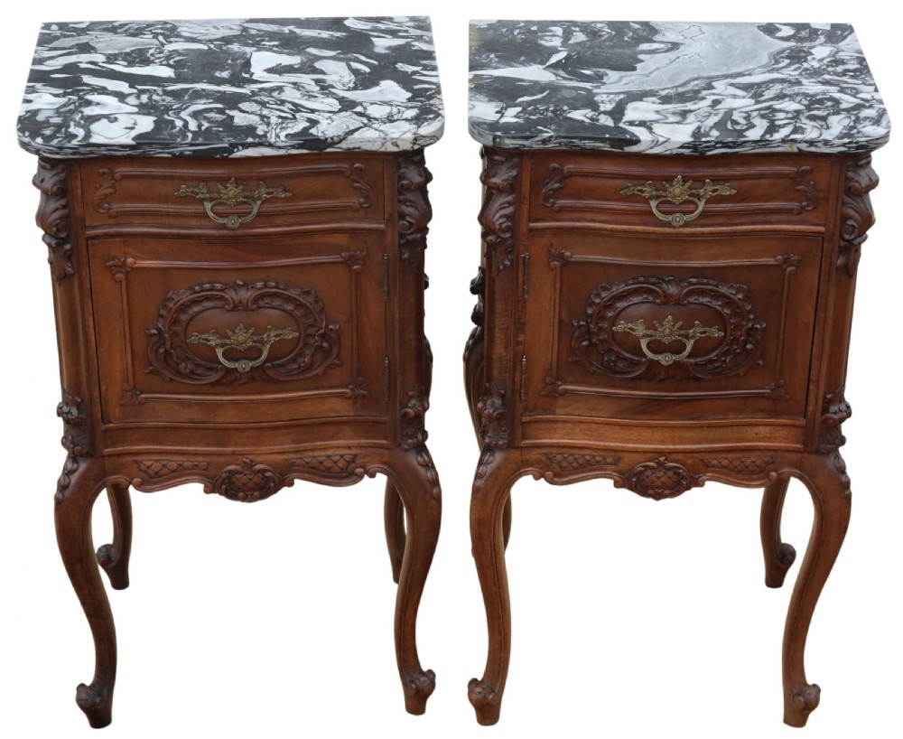A pair of carved walnut bedside tables with dark grey patterned marble tops, single drawers, cupboard doors, and cabriole legs. View II