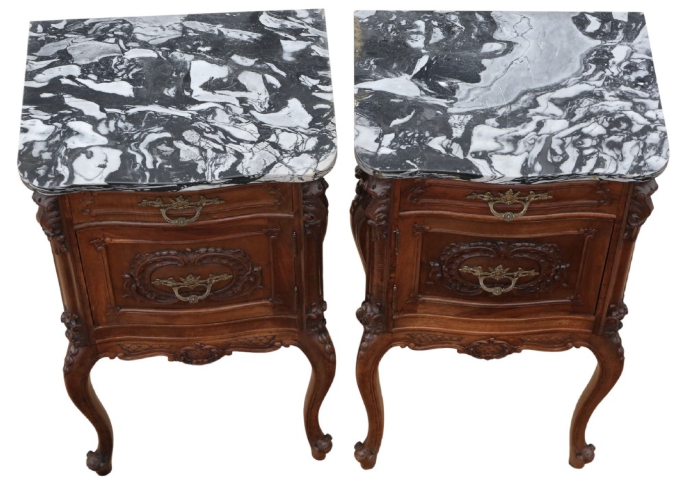 A pair of carved walnut bedside tables with dark grey patterned marble tops, single drawers, cupboard doors, and cabriole legs. View III