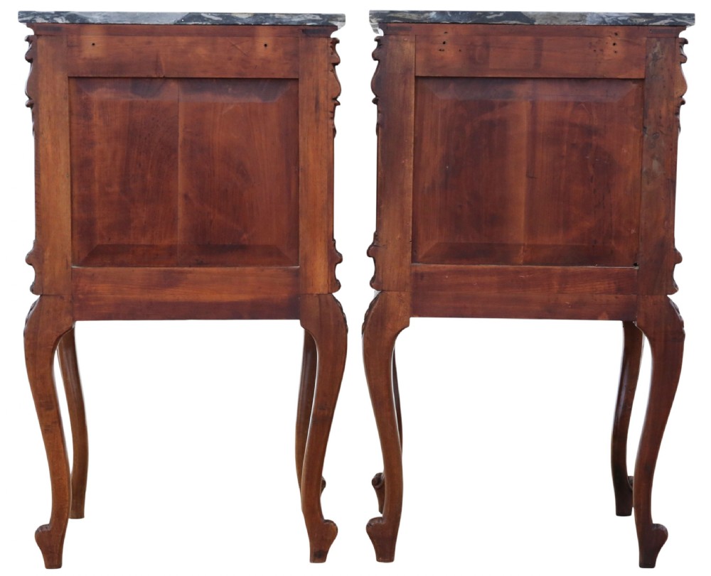 A pair of carved walnut bedside tables with dark grey patterned marble tops, single drawers, cupboard doors, and cabriole legs. View VII