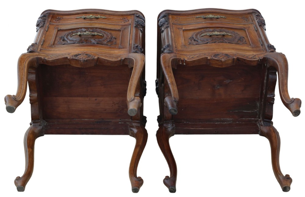 A pair of carved walnut bedside tables with dark grey patterned marble tops, single drawers, cupboard doors, and cabriole legs. View VIII