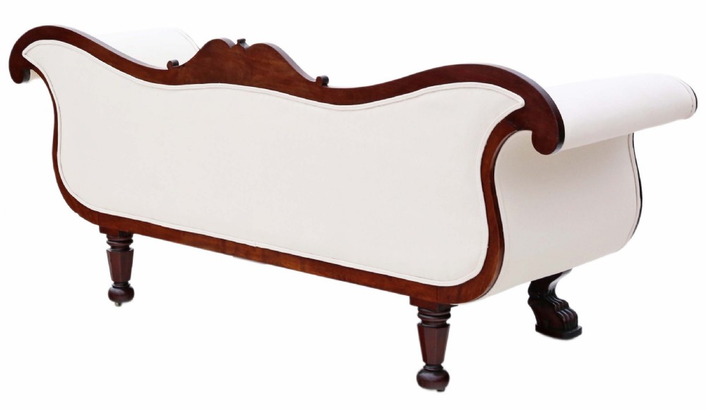 A 19th-century mahogany scroll arm sofa upholstered in neutral cream fabric with two matching bolster cushions and carved timber details. View III