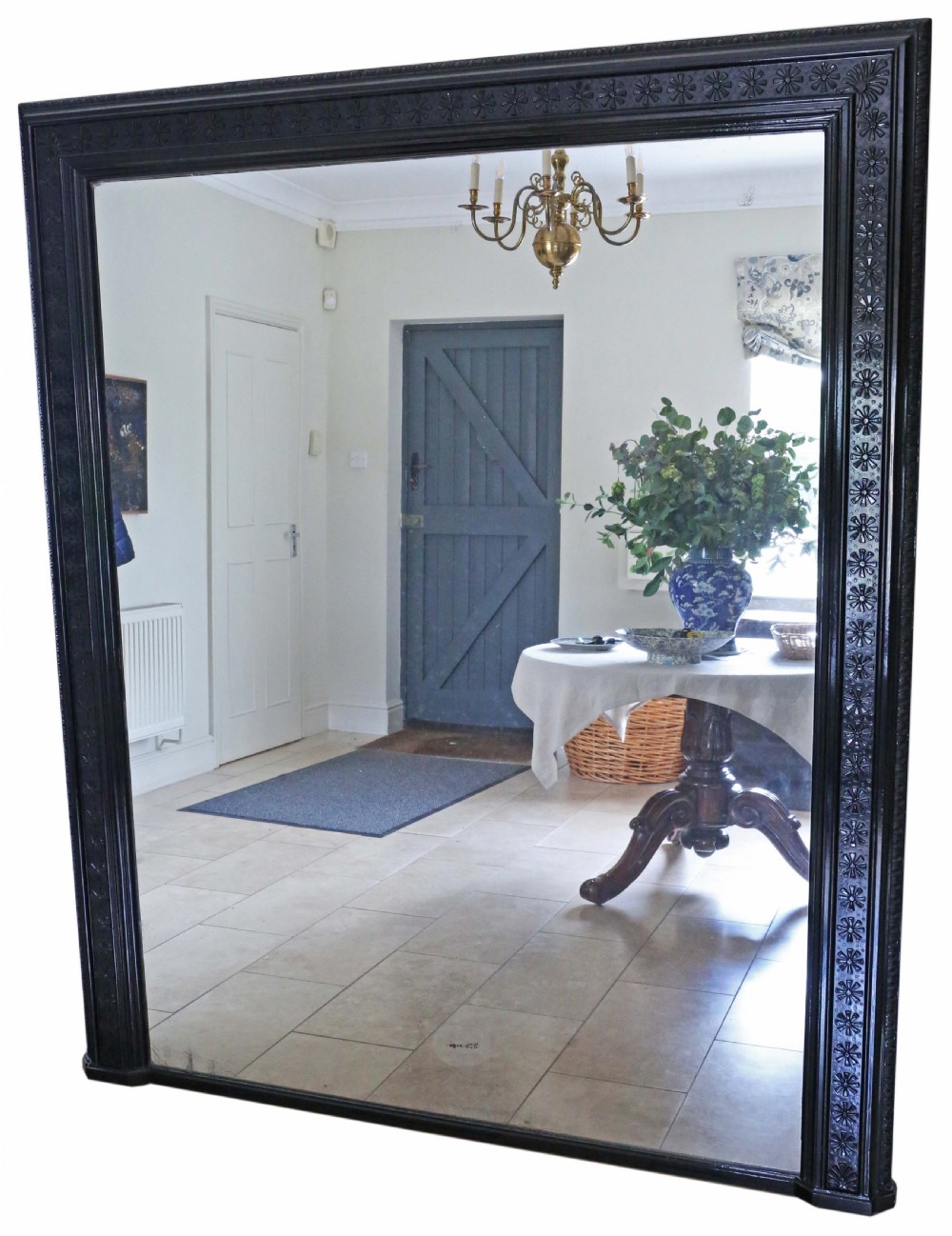 A large, late 19th-century rectangular floor mirror with a wide, ebonised wooden frame decorated with carved rosette mouldings. View II