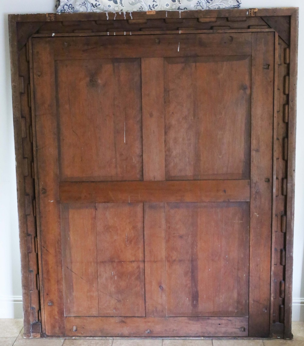 A large, late 19th-century rectangular floor mirror with a wide, ebonised wooden frame decorated with carved rosette mouldings. View VIII