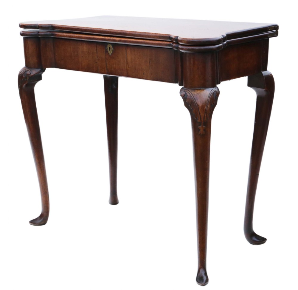 A George II mahogany folding tea table featuring a shaped fold-over top, a single drawer with a brass keyhole escutcheon, and carved cabriole legs ending in pad feet. View XI