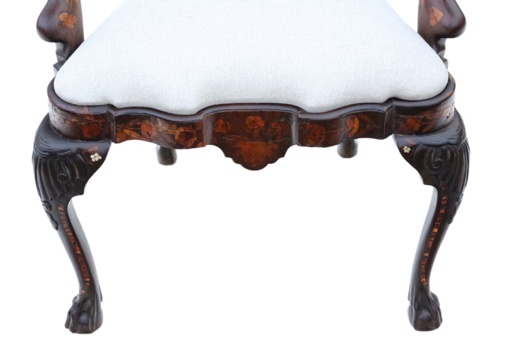 An 18th-century Dutch marquetry armchair featuring intricate floral wood inlays, carved cabriole legs with claw-and-ball feet, curved armrests, and a cream upholstered seat. View VII