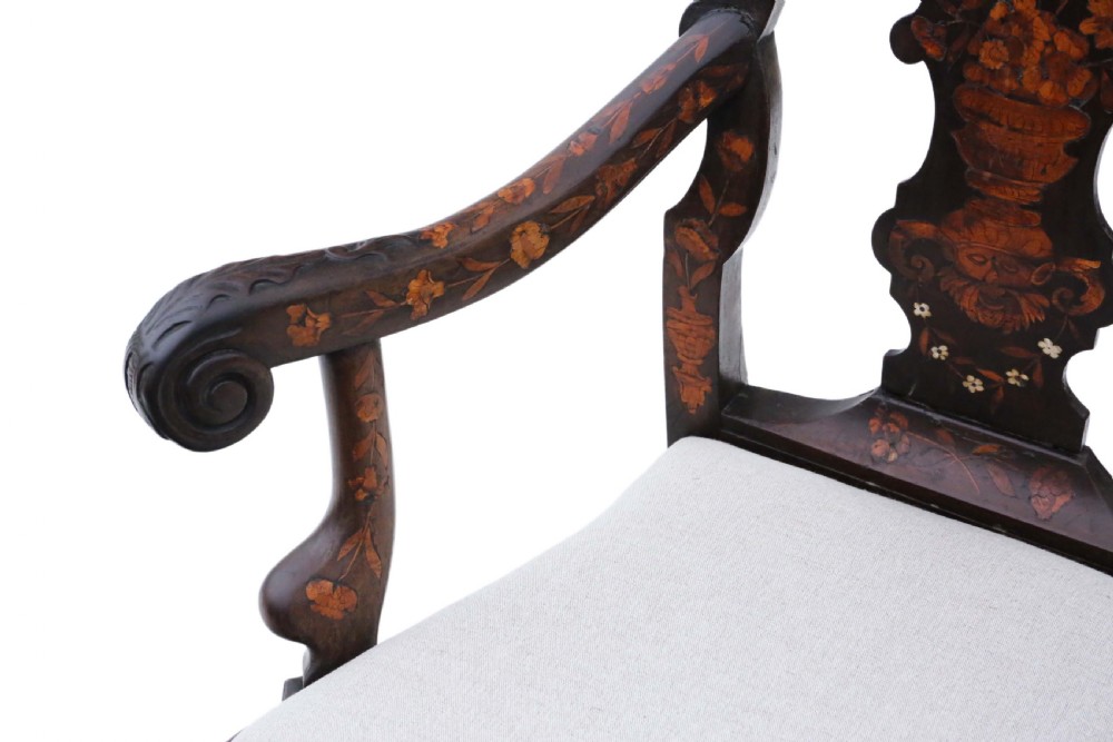 An 18th-century Dutch marquetry armchair featuring intricate floral wood inlays, carved cabriole legs with claw-and-ball feet, curved armrests, and a cream upholstered seat. View VIII