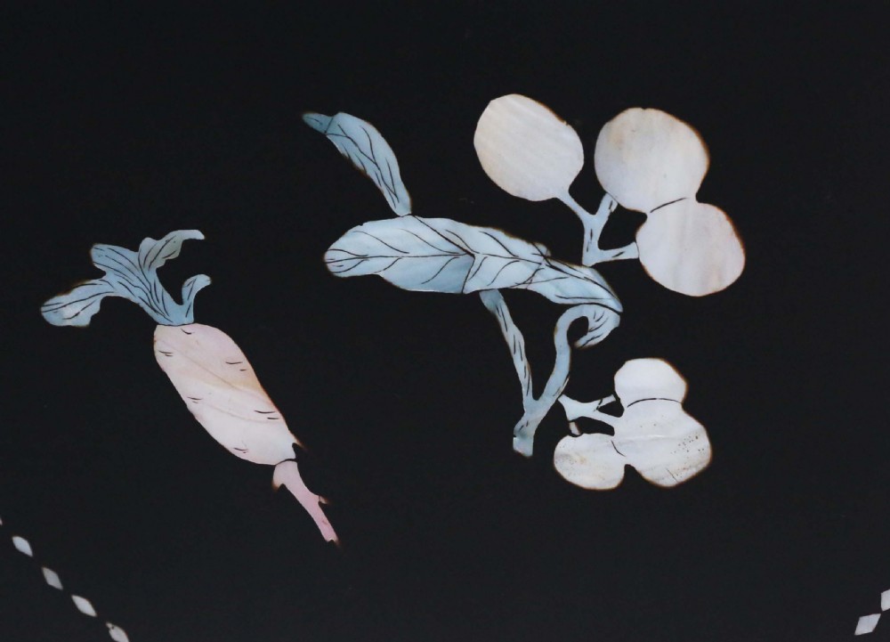A four-panel black lacquer dressing screen decorated with inlaid mother-of-pearl birds, flowering branches, and circular floral medallions. View VI