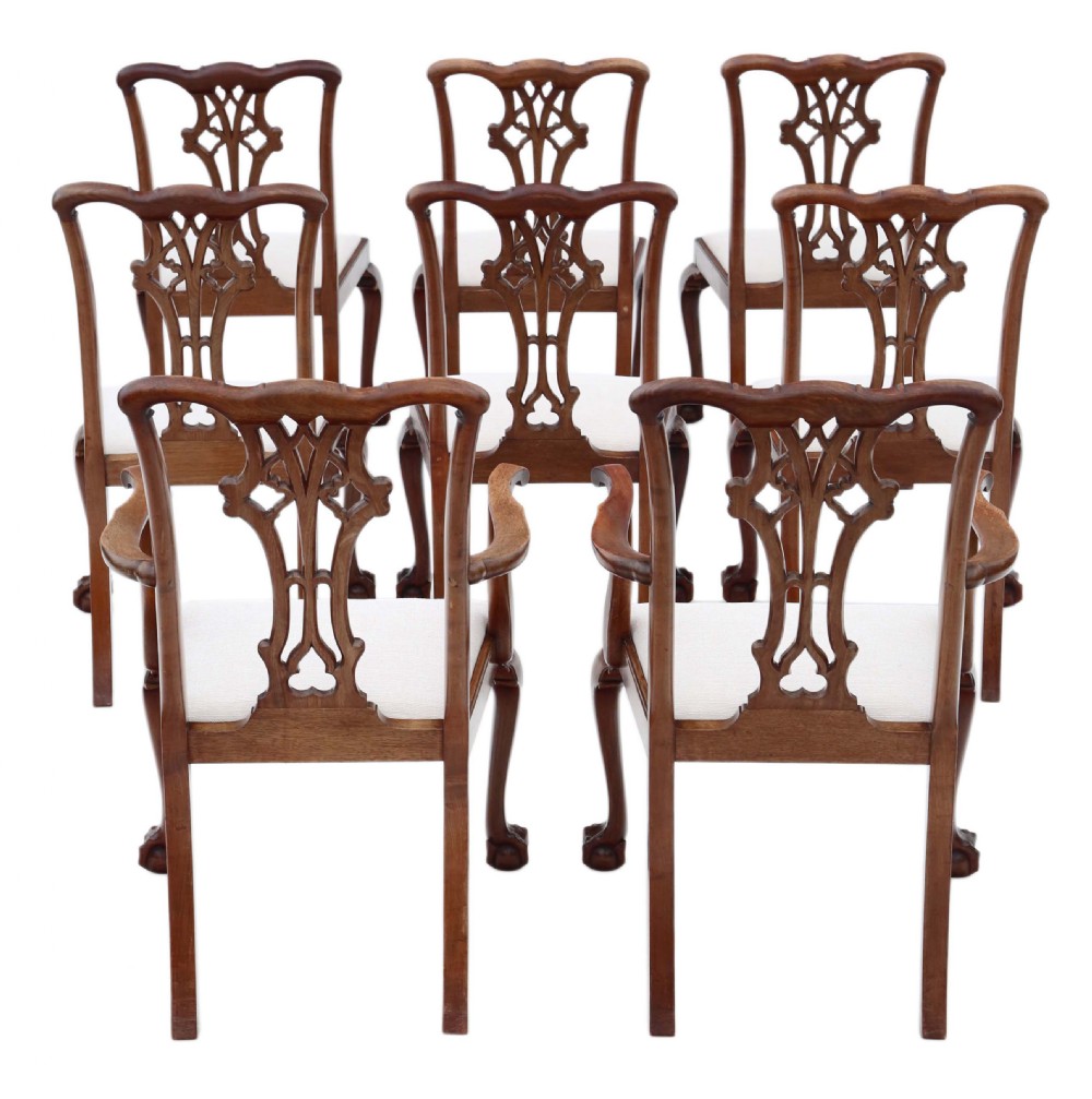 A set of eight Georgian Revival mahogany dining chairs featuring carved pierced splats, cabriole legs with ball-and-claw feet, and white upholstered seats. View II