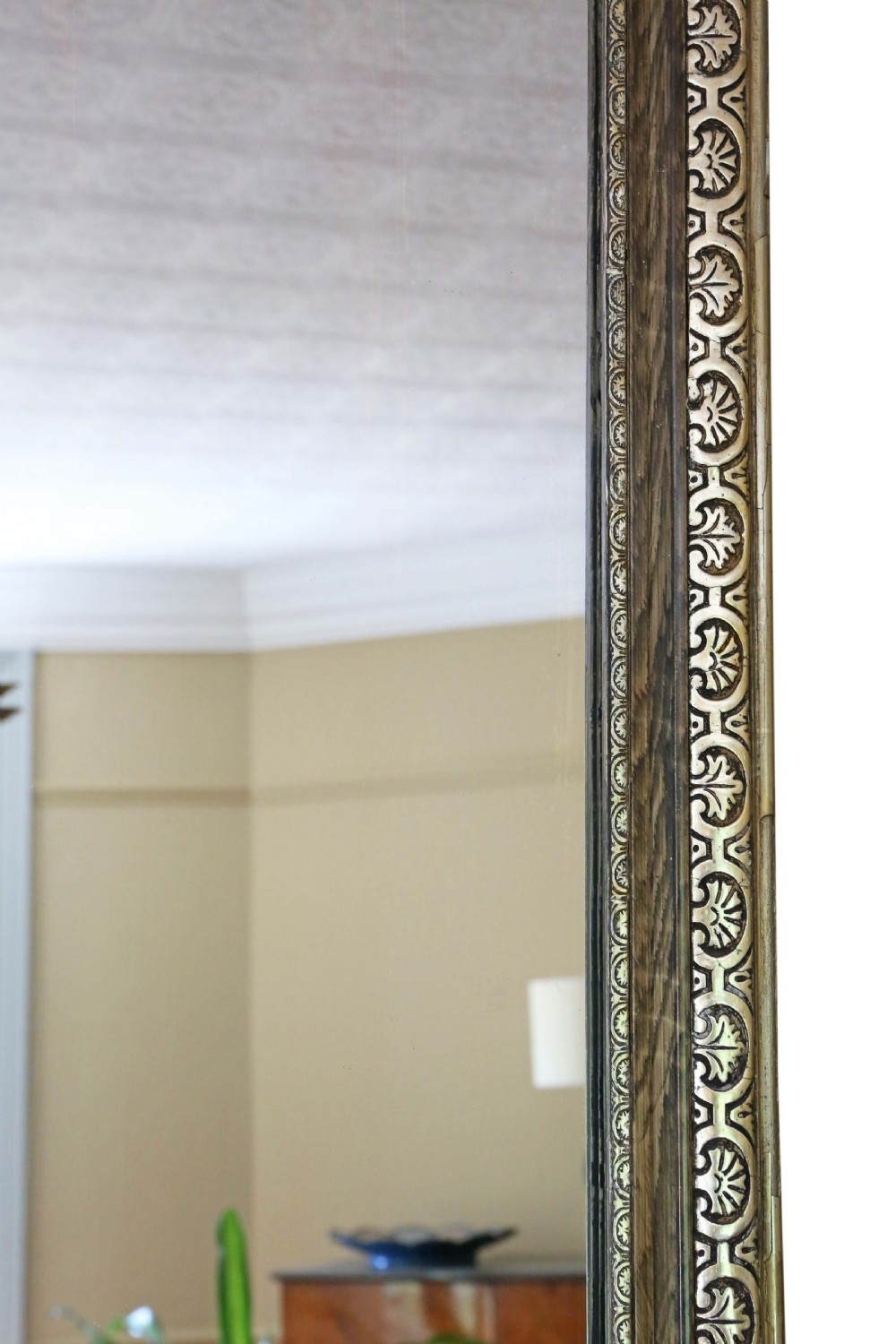 A large rectangular antique gilt mirror featuring a central cherub crest, acanthus scrollwork, and an anthemion pattern frame. View V